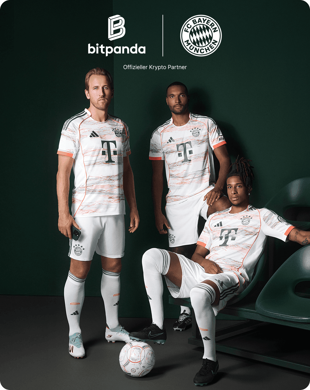 Three soccer players in FC Bayern Munich uniforms pose with a ball. The backdrop features Bitpanda and FC Bayern logos.