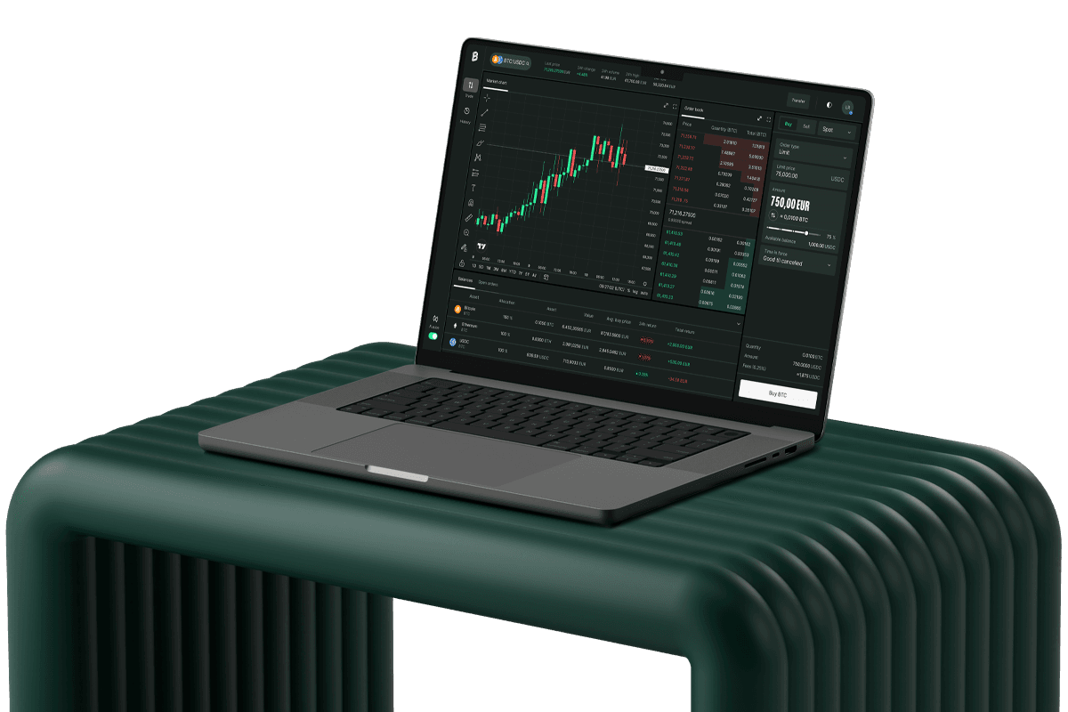 Open laptop on a dark green bench displaying a cryptocurrency trading platform with candlestick chart and order book.