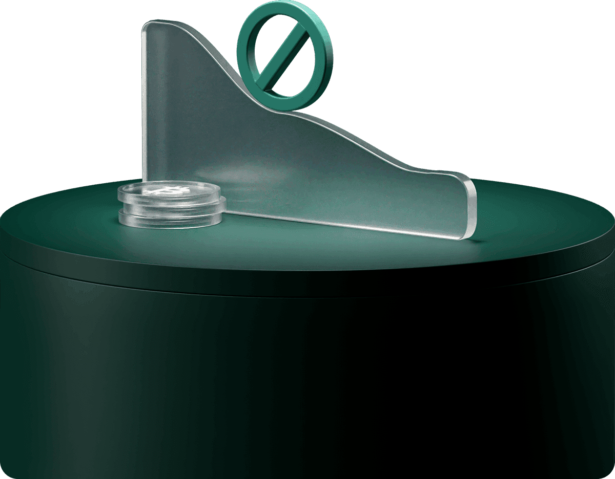 A dark green cylindrical object with a transparent sloped panel and a circular symbol on top, set against a plain background.